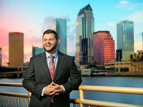 Portrait of the owner against a cityscape