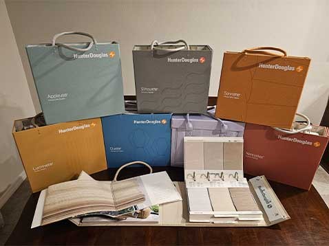 Hunter Douglas branded cases displayed on a table